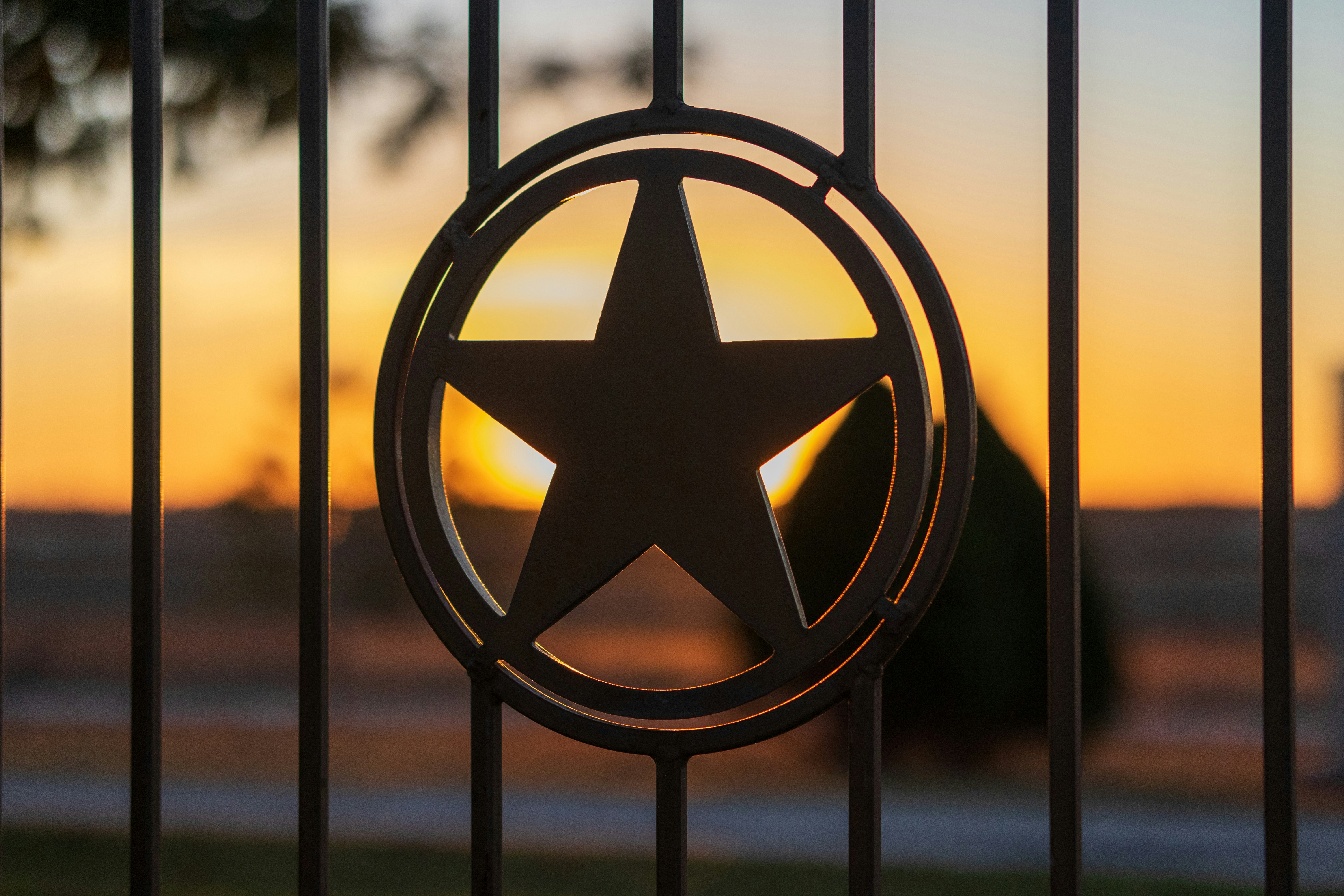 Boutique ranch hotel entry sign in the Texas Hill Country at golden hour
